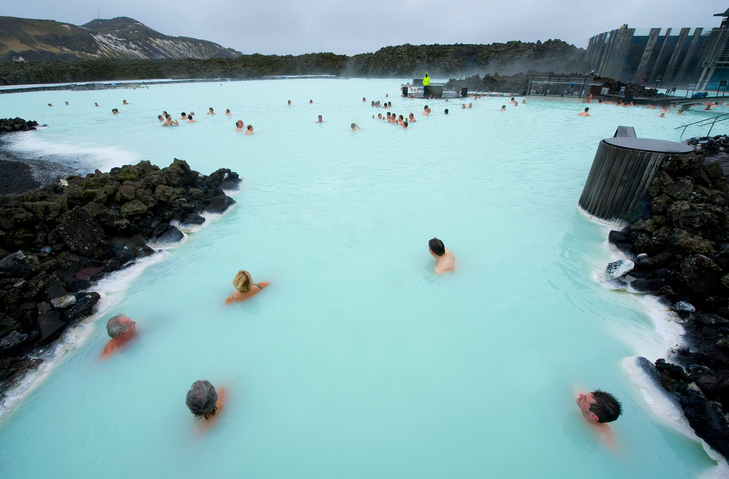 Reykjavik, Iceland - March 08, 2013: People bathing in The Blue Lagoon, a geothermal bath resort in the south of Iceland, a 'must see' by tourists. The water is sourced from a power station nearby.