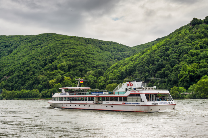 Assmannshausen, Germany - May 23, 2016: Inland Passenger Vessel Godesburg on the Rhine River in cloudy weather near Assmannshausen village, Rhine Valley, Hesse, Germany.