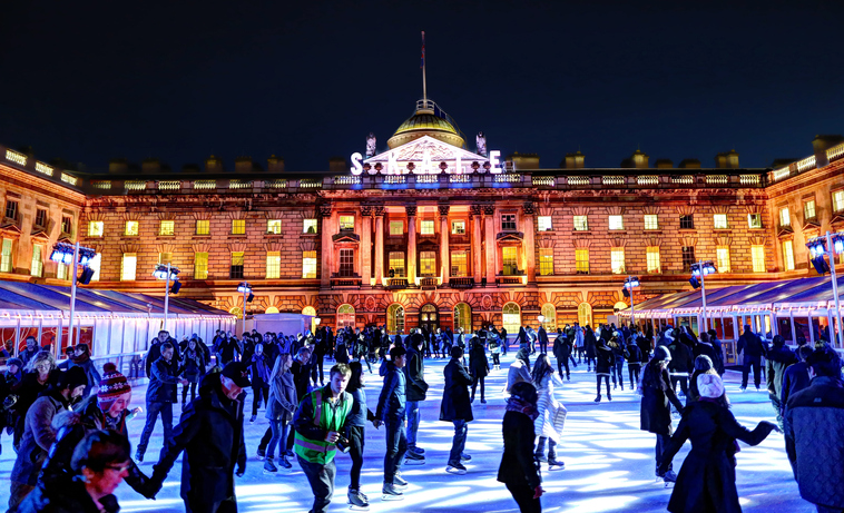 London, United Kingdom - November 22, 2012: People skating on a crowded ice skating rink in Somerset House in the evening.