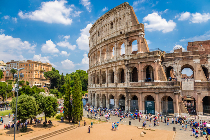 Colosseum with clear blue sky and clouds, Rome. Panorama