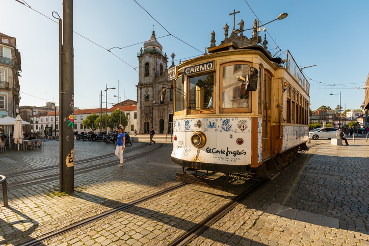 Old Fashioned trolley car outside of Carmo Church (Igreja do Carmo) in Porto, Portugal.