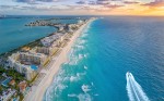 Gol anuncia retomada de voos diretos para Cancún Cancun beach with boat