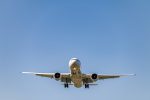 low-angle-shot-airplane-flying-closer-daytime